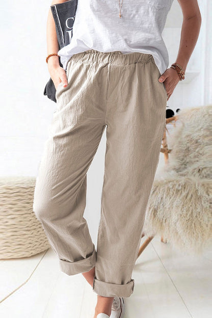 Pantalones con cintura paperbag brillante y bolsillos