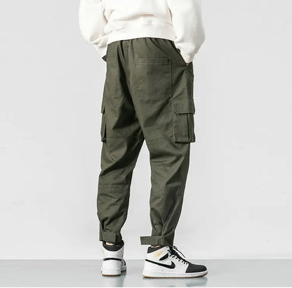 Pantalones harén de algodón con múltiples bolsillos y cintura elástica para hombre, pantalones casuales de estilo punk callejero y hip hop, pantalones de chándal estilo militar para hombre