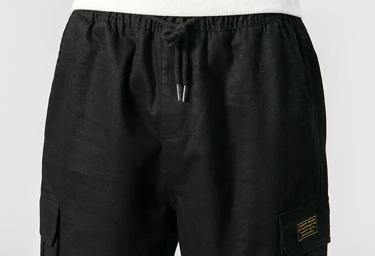 Pantalones harén de algodón con múltiples bolsillos y cintura elástica para hombre, pantalones casuales de estilo punk callejero y hip hop, pantalones de chándal estilo militar para hombre