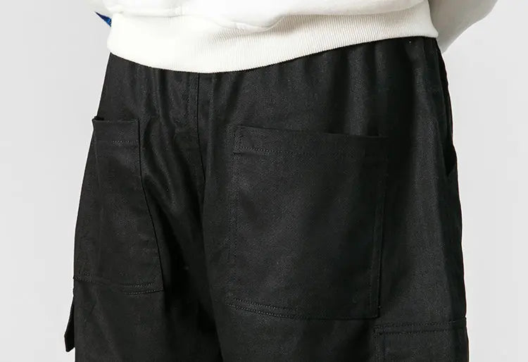 Pantalones harén de algodón con múltiples bolsillos y cintura elástica para hombre, pantalones casuales de estilo punk callejero y hip hop, pantalones de chándal estilo militar para hombre