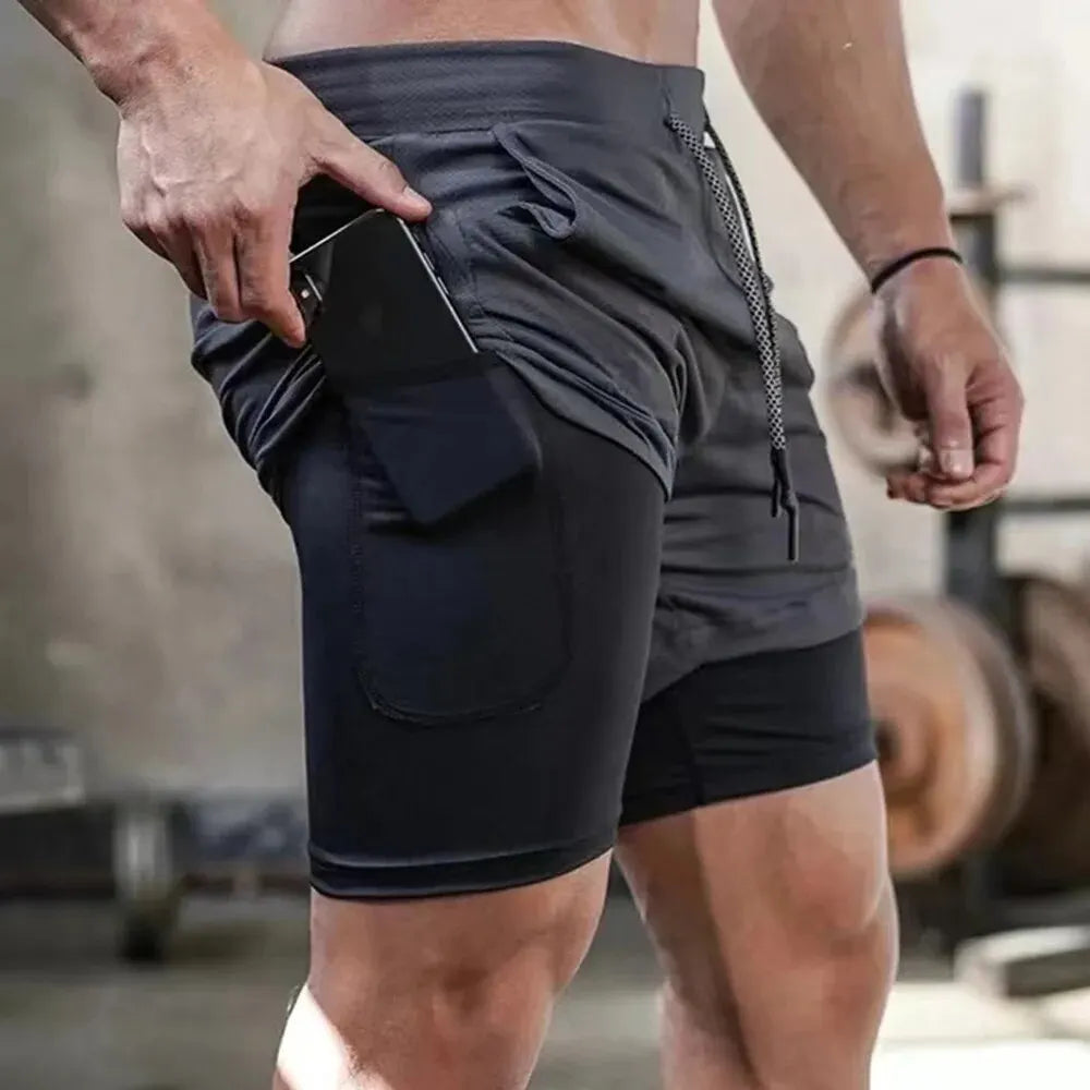 Pantalones cortos de gimnasio para hombre, pantalones cortos para correr con bolsillos interiores, presilla para toalla, pantalones cortos deportivos ligeros de secado rápido para entrenamiento para hombre