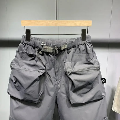 Pantalones cortos de verano para hombre, estilo coreano, de color negro, con cintura alta, de gran tamaño, con múltiples bolsillos y carga, para entrenamiento físico