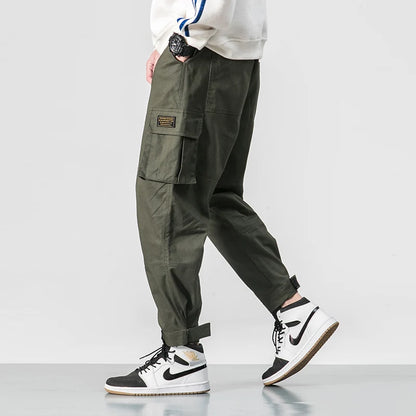 Pantalones harén de algodón con múltiples bolsillos y cintura elástica para hombre, pantalones casuales de estilo punk callejero y hip hop, pantalones de chándal estilo militar para hombre