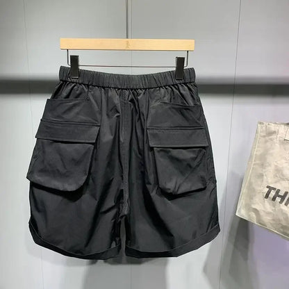 Pantalones cortos de verano para hombre, estilo coreano, de color negro, con cintura alta, de gran tamaño, con múltiples bolsillos y carga, para entrenamiento físico