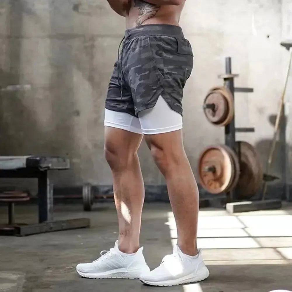 Pantalones cortos de gimnasio para hombre, pantalones cortos para correr con bolsillos interiores, presilla para toalla, pantalones cortos deportivos ligeros de secado rápido para entrenamiento para hombre