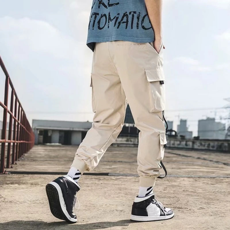 Pantalones cargo de estilo hip hop para hombre, pantalón harén, con múltiples bolsillos y cintas, ropa de calle, informal, tallas M a 6XL