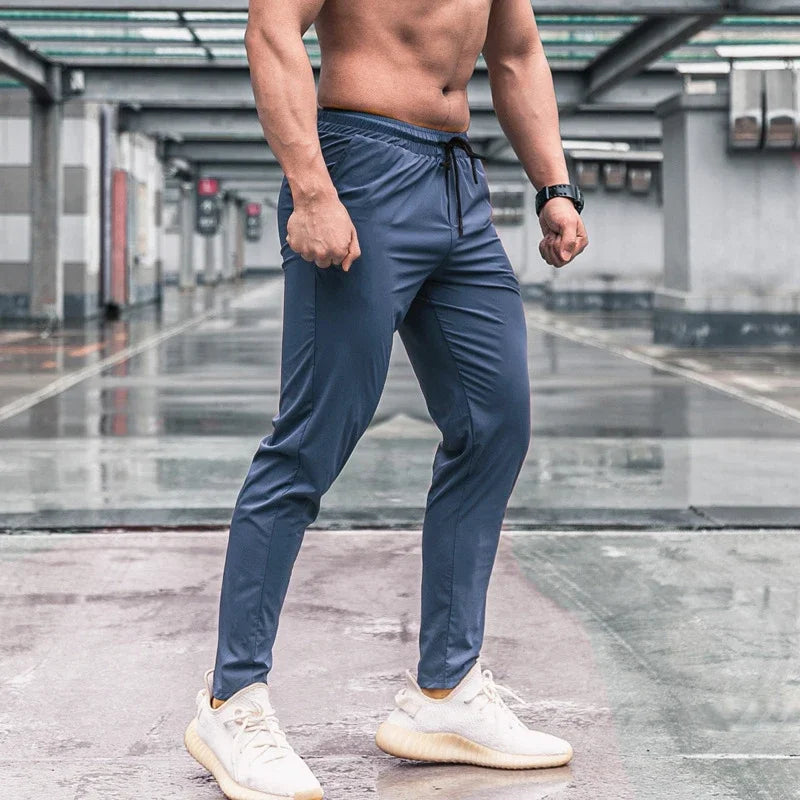 Pantalones deportivos para hombre con bolsillos, pantalones de entrenamiento para correr, pantalones deportivos de secado rápido, pantalones deportivos de alta calidad