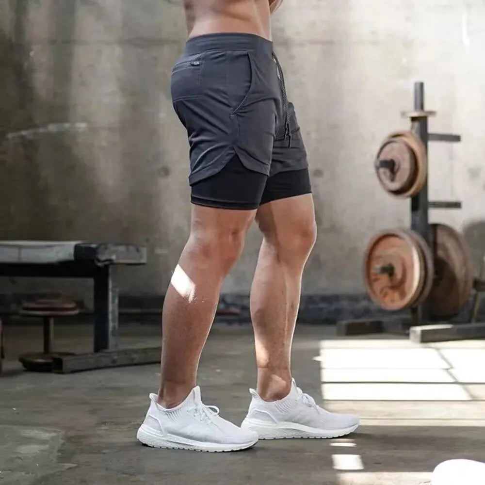 Pantalones cortos de gimnasio para hombre, pantalones cortos para correr con bolsillos interiores, presilla para toalla, pantalones cortos deportivos ligeros de secado rápido para entrenamiento para hombre