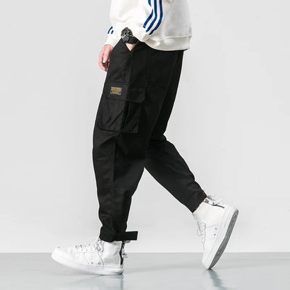 Pantalones harén de algodón con múltiples bolsillos y cintura elástica para hombre, pantalones casuales de estilo punk callejero y hip hop, pantalones de chándal estilo militar para hombre