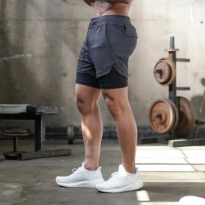 Pantalones cortos de gimnasio para hombre, pantalones cortos para correr con bolsillos interiores, presilla para toalla, pantalones cortos deportivos ligeros de secado rápido para entrenamiento para hombre