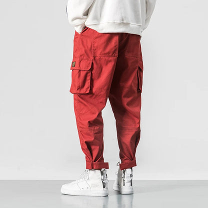 Pantalones harén de algodón con múltiples bolsillos y cintura elástica para hombre, pantalones casuales de estilo punk callejero y hip hop, pantalones de chándal estilo militar para hombre