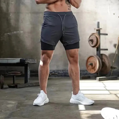 Pantalones cortos de gimnasio para hombre, pantalones cortos para correr con bolsillos interiores, presilla para toalla, pantalones cortos deportivos ligeros de secado rápido para entrenamiento para hombre