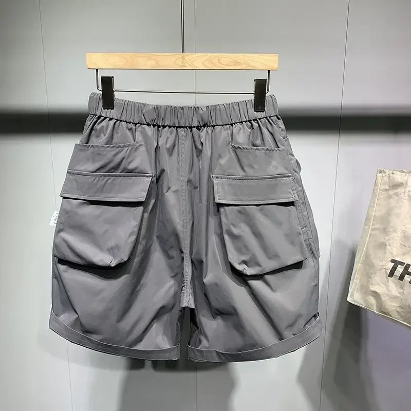 Pantalones cortos de verano para hombre, estilo coreano, de color negro, con cintura alta, de gran tamaño, con múltiples bolsillos y carga, para entrenamiento físico