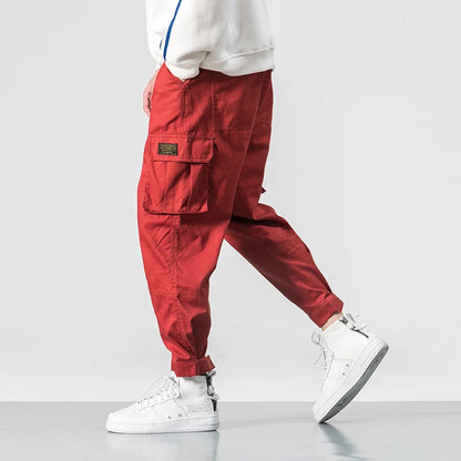 Pantalones harén de algodón con múltiples bolsillos y cintura elástica para hombre, pantalones casuales de estilo punk callejero y hip hop, pantalones de chándal estilo militar para hombre