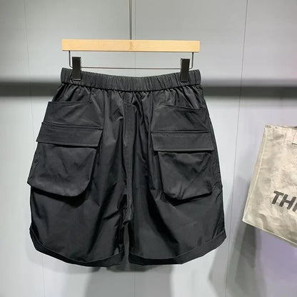 Pantalones cortos de verano para hombre, estilo coreano, de color negro, con cintura alta, de gran tamaño, con múltiples bolsillos y carga, para entrenamiento físico